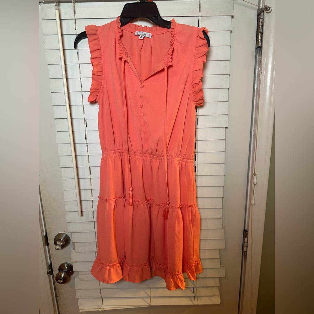 Orange knee length dress with ruffles